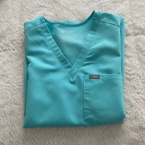 Neon blue figs scrub set. Size small in top. Size small tall in bottoms.